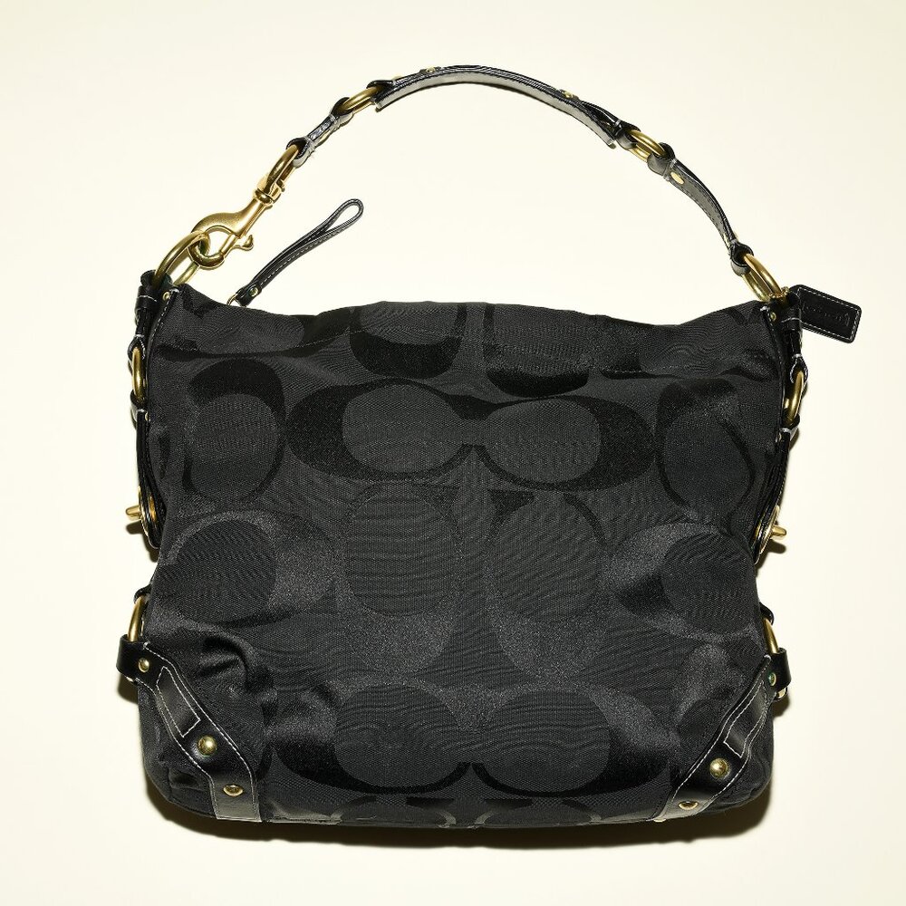 Coach Karley Arch Purse (Model J0773–10620) in Black with Signature C Pattern.